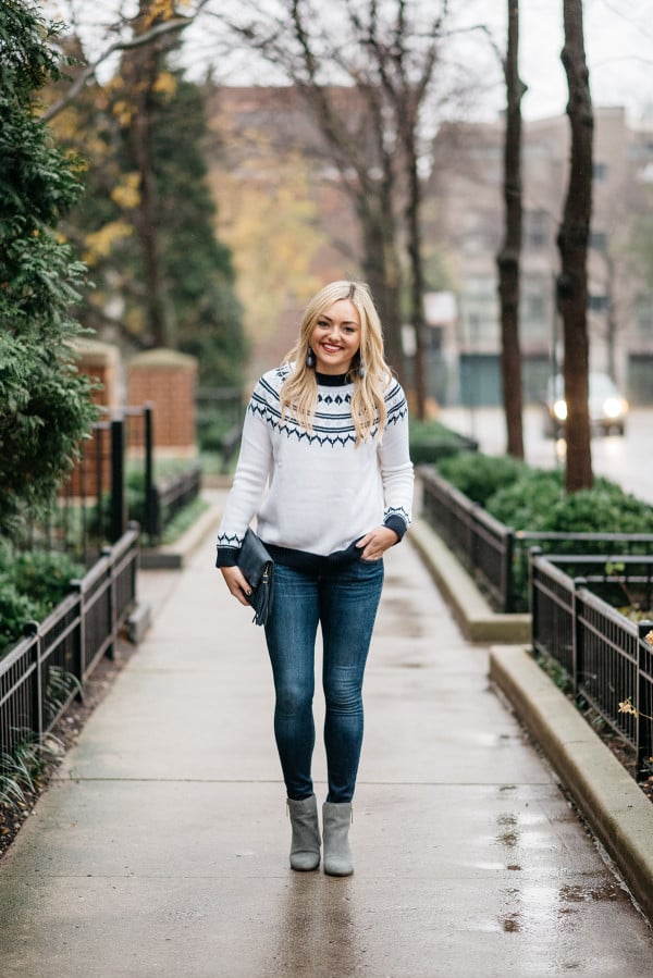 Bows & Sequins wearing a casual outfit for the holidays: fair isle sweater, skinny jeans, and ankle booties.
