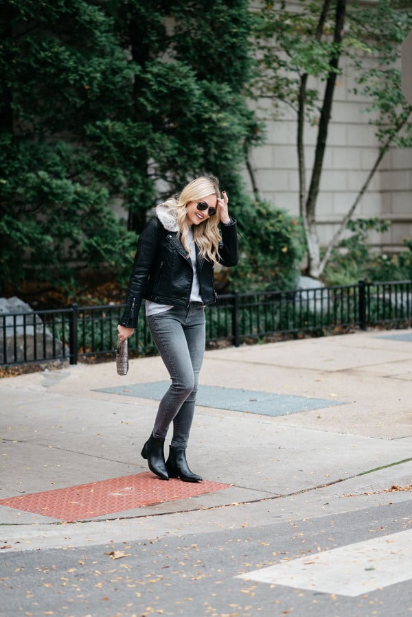 Jessica Sturdy, Chicago-based fashion and travel blogger, wearing a Topshop leather jacket, grey jeans, and Marc Fisher booties.