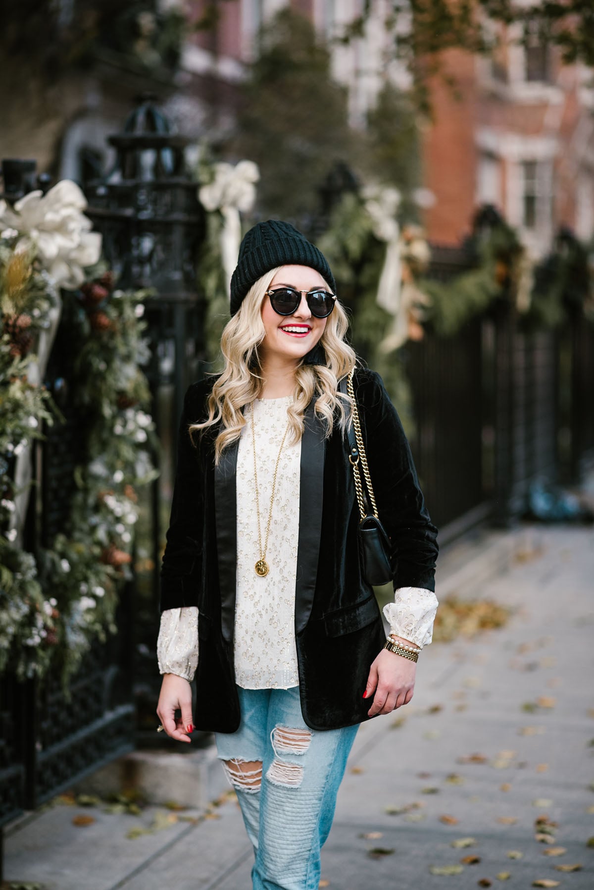 Bows & Sequins styling a black velvet blazer with a beanie and boyfriend jeans.