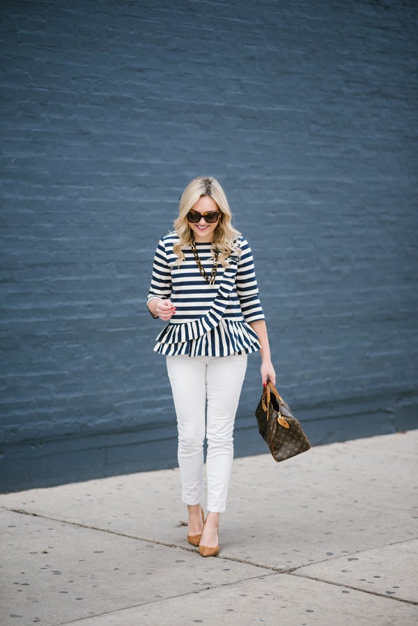 Bows & Sequins styling a ruffled, stripe peplum top with white corduroy jeans and suede pumps.