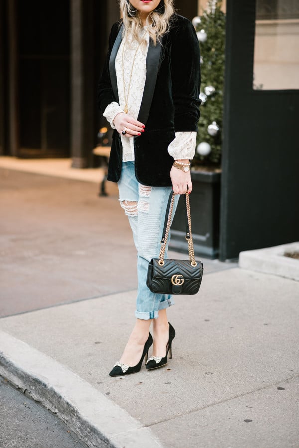 Bows & Sequins styling a pair of rag and bone boyfriend jeans with a metallic blouse, velvet blazer, pointed pumps, and a Gucci bag.