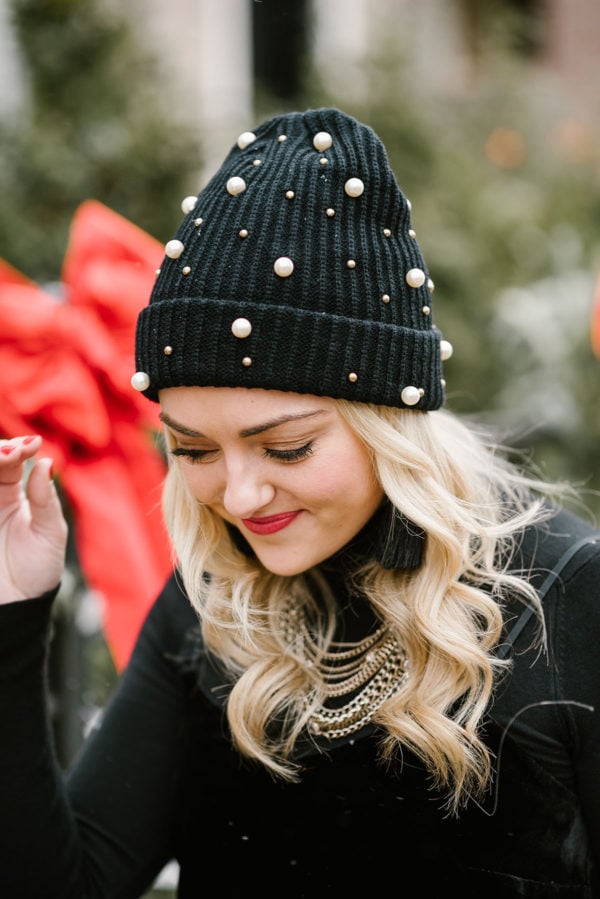 Bows & Sequins wearing a black beanie embellished with pearls!