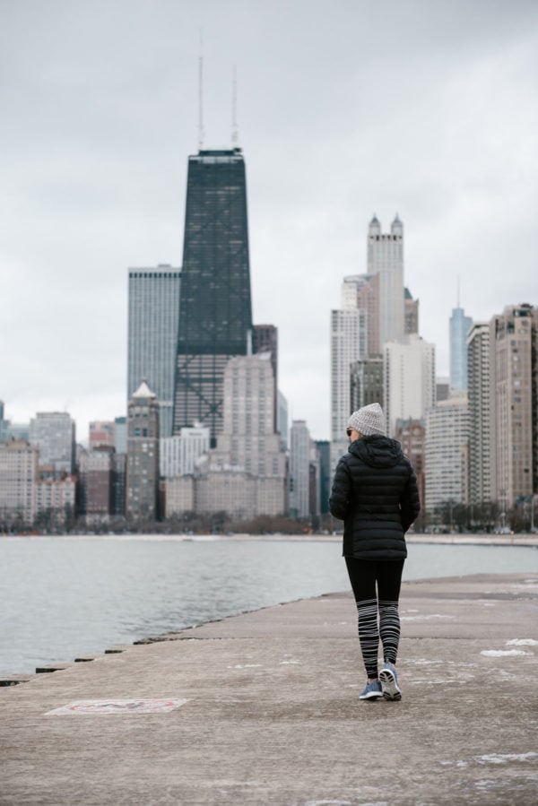 Bows & Sequins wearing workout clothes by Lake Michigan in Chicago