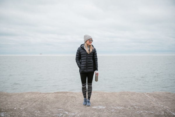 Bows & Sequins wearing cold-weather workout gear by Lake Michigan in Chicago.