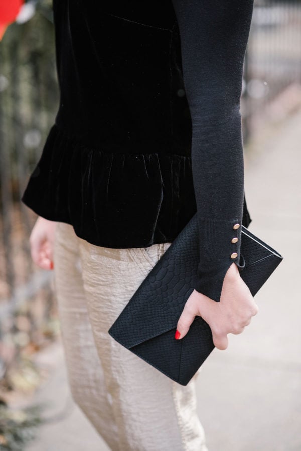Bows & Sequins wearing J.Crew's black velvet peplum top.