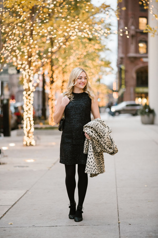 Bows & Sequins wearing an outfit for a holiday party in Chicago: Black Tweed Dress, Black Tights, Black Glitter Pumps, and a Leopard-Print Coat.