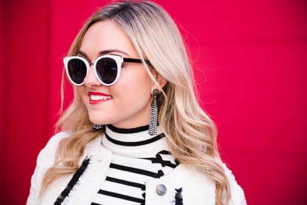 Bows & Sequins wearing a black and white striped turtleneck.
