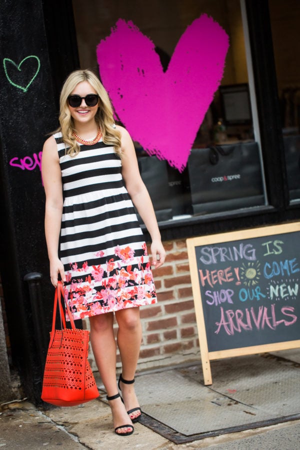 Bows & Sequins wearing a striped floral dress in Nolita in New York City.