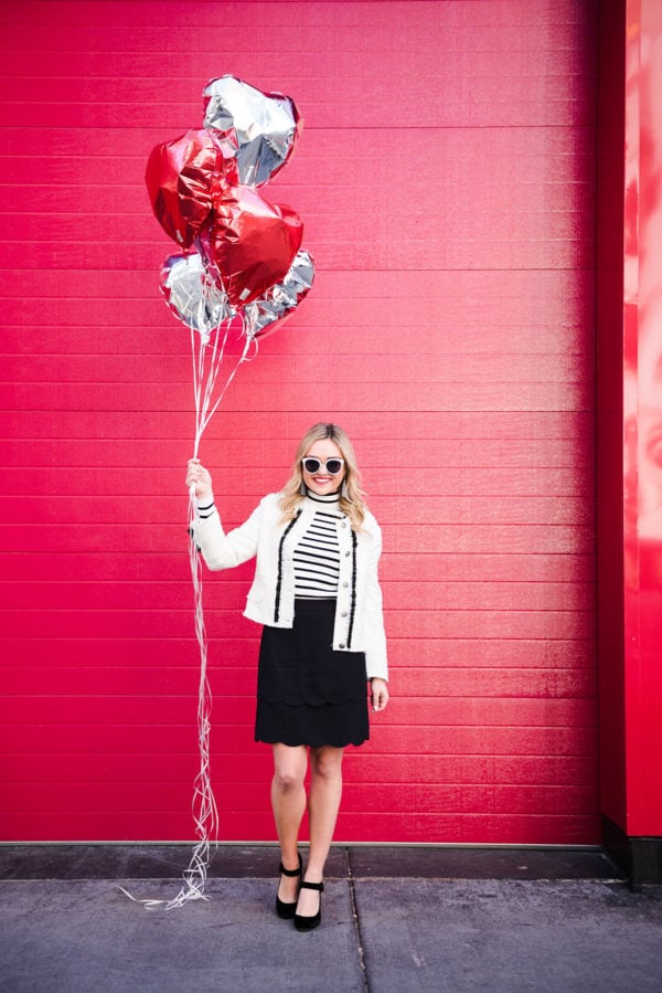 Bows & Sequins wearing a black and white outfit for Valentine's Day.