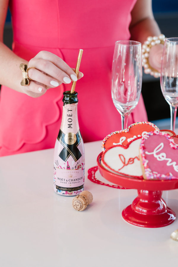 Bows & Sequins hosting a Valentine's Day party with champagne and cookies.