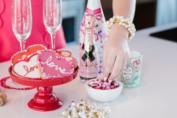 Bows & Sequins Valentine's Day party with cookies champagne and candy.