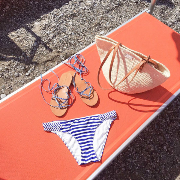 Orange Beach Chairs in Positano, Italy with a Striped Bikini and Straw Tote