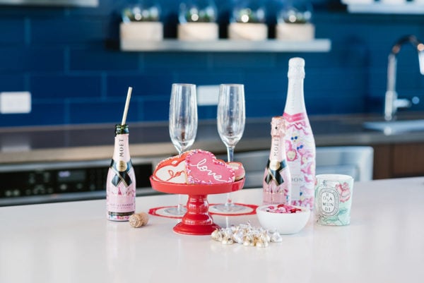 Bows & Sequins hosting a Valentine's Day party in Chicago with champagne cookies and candy.