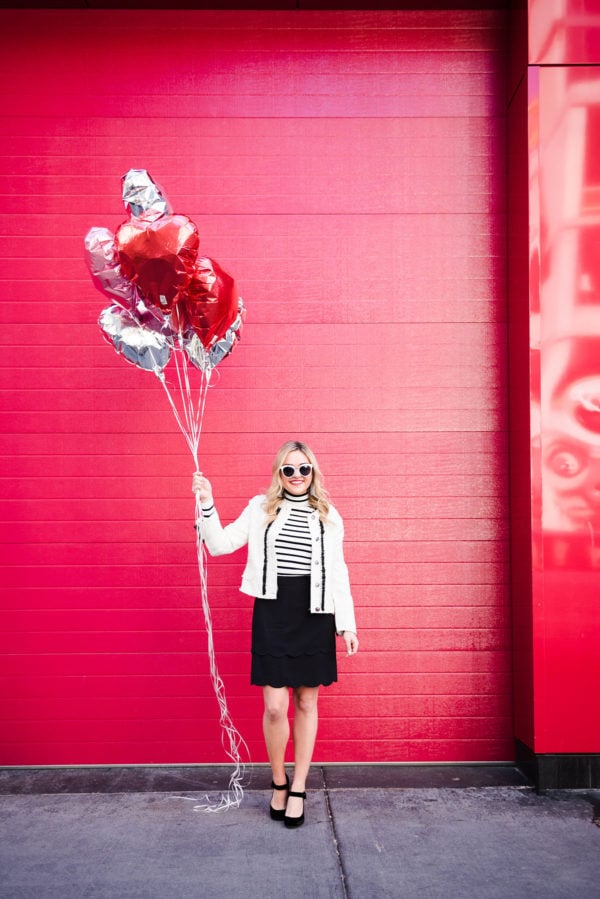 Bows & Sequins wearing a tweed jacket, striped turtleneck, scalloped skirt, and velvet mary janes.