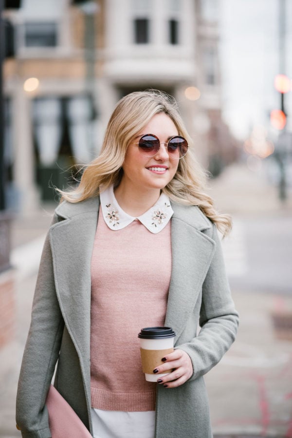 Bows & Sequins modeling mint green jacket.