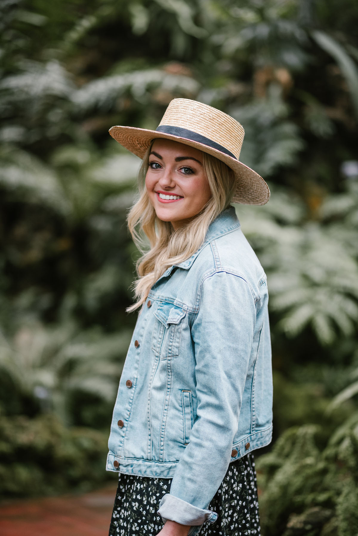 Chicago style blogger Bows & Sequins wearing a Janessa Leone hat with a denim jacket.