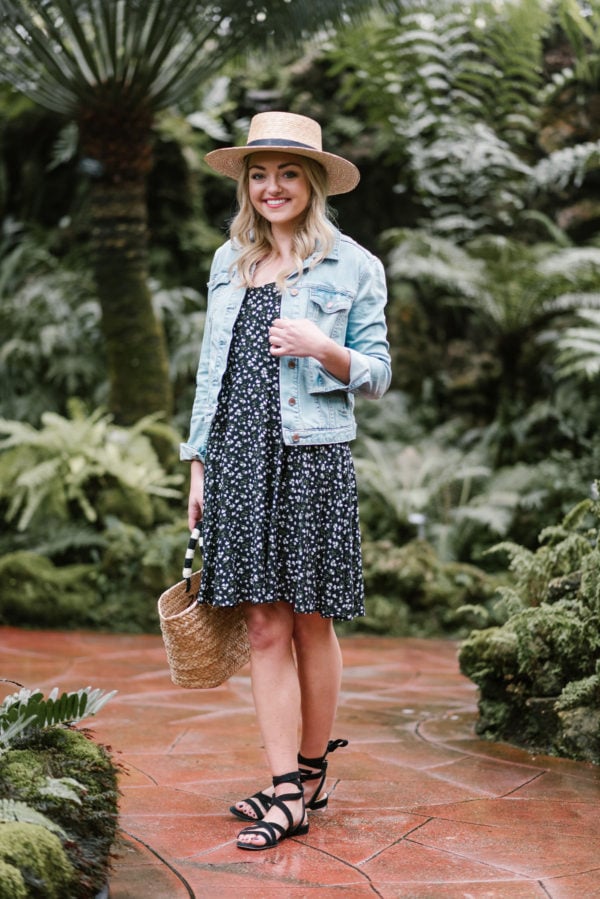 Chicago blogger Jessica Sturdy wearing an Old Navy floral dress with black lace up sandals and a denim jacket.