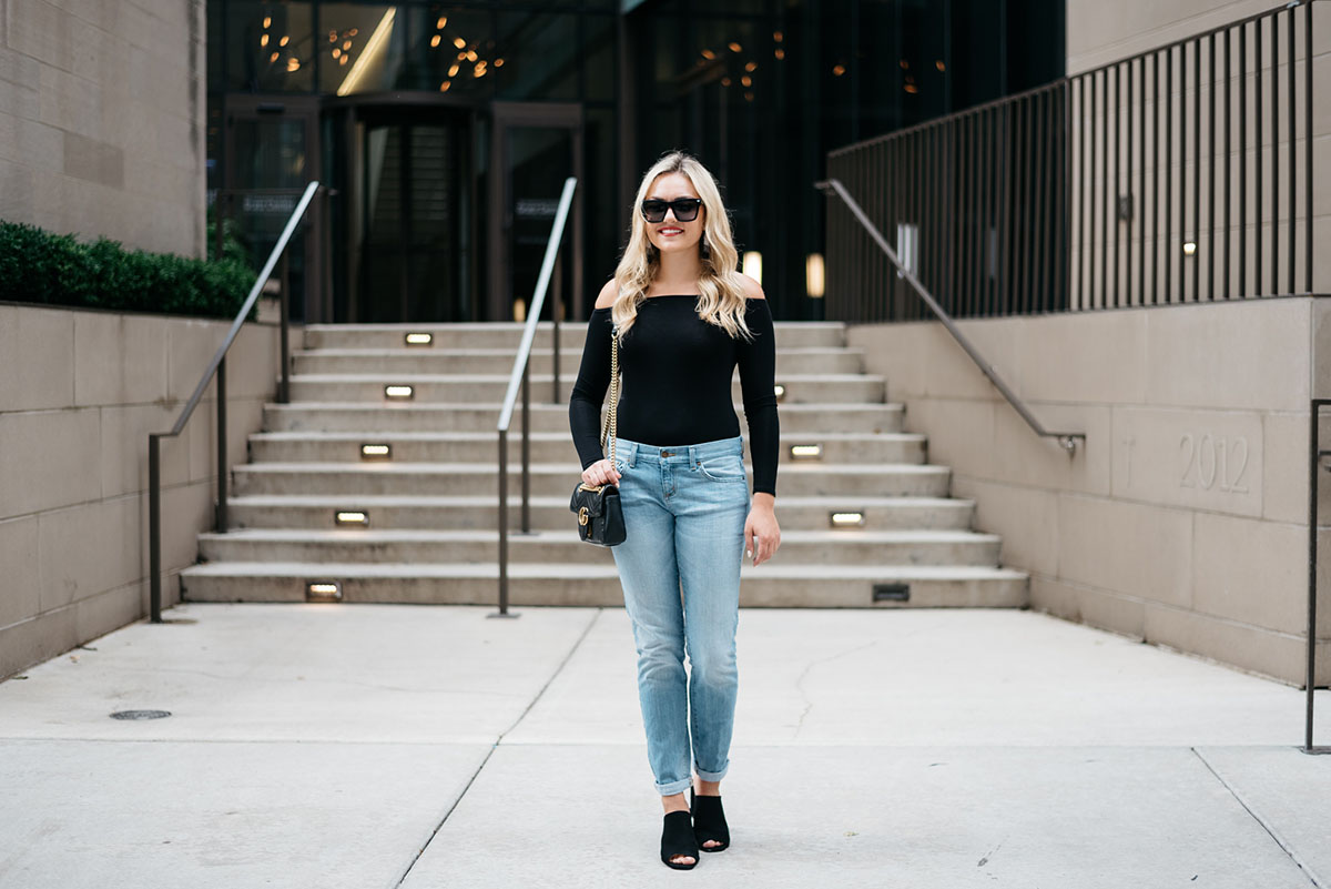 black bodysuit and jeans