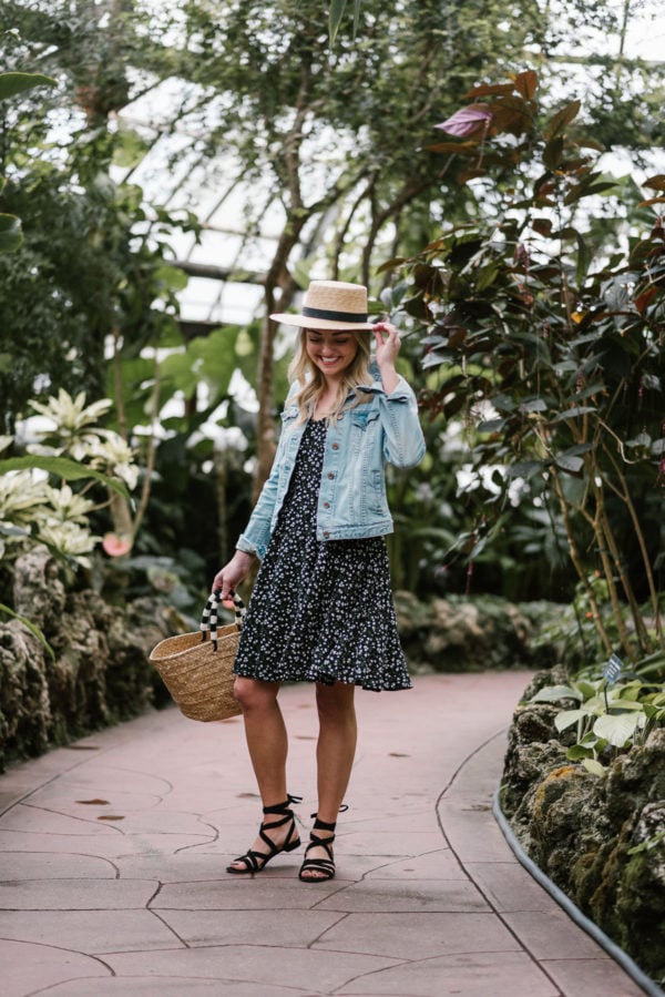 Blogger Bows & Sequins wearing an Old Navy summer dress with a denim jacket and lace-up flat sandals for spring.