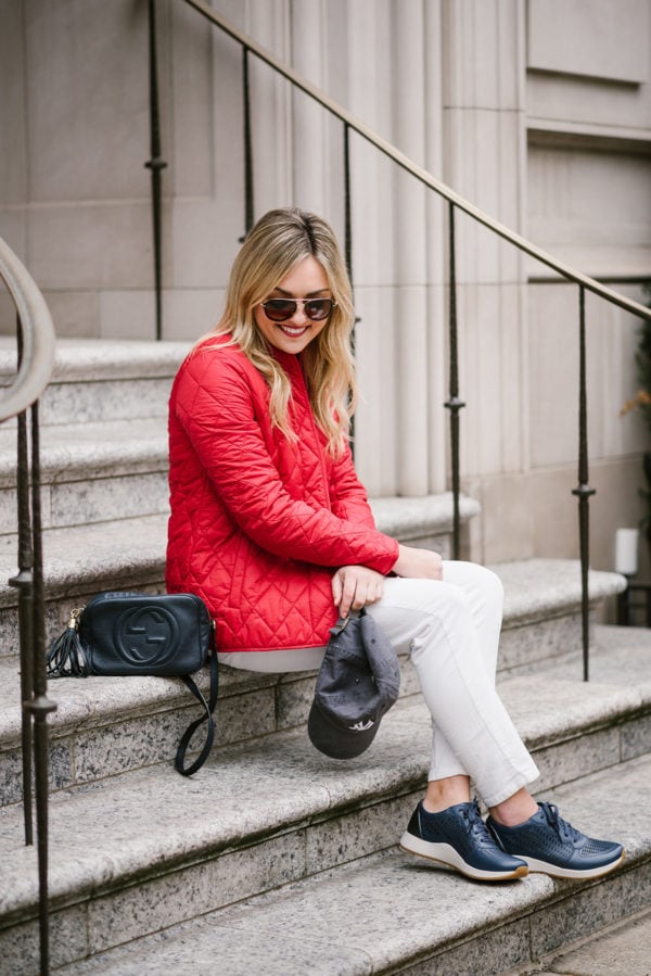 Bows & Sequins wearing a quilted red Barbour jacket.