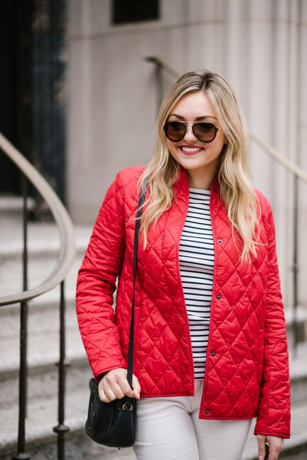 Bows & Sequins wearing Celine sunglasses, a striped shirt, and a red quilted jacket.