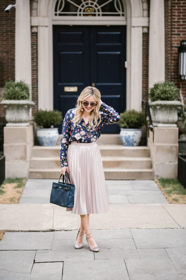 Jessica of Bows & Sequins wearing a navy floral Rebecca Taylor blouse, Rachel Roy pleated midi skirt, Kate Spade blush pink glitter pumps, and Celine tortoise aviator sunglasses.
