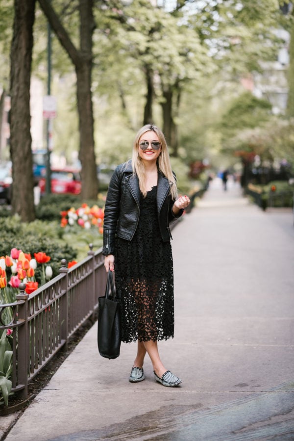 Bows & Sequins wearing a Topshop moto jacket, ASTR black lace dress, and Celine mirrored aviators.