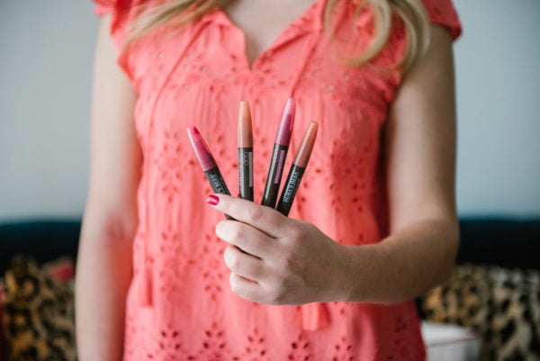 Beauty blogger Bows & Sequins sampling Burt's Bees Tinted Lip Oils.