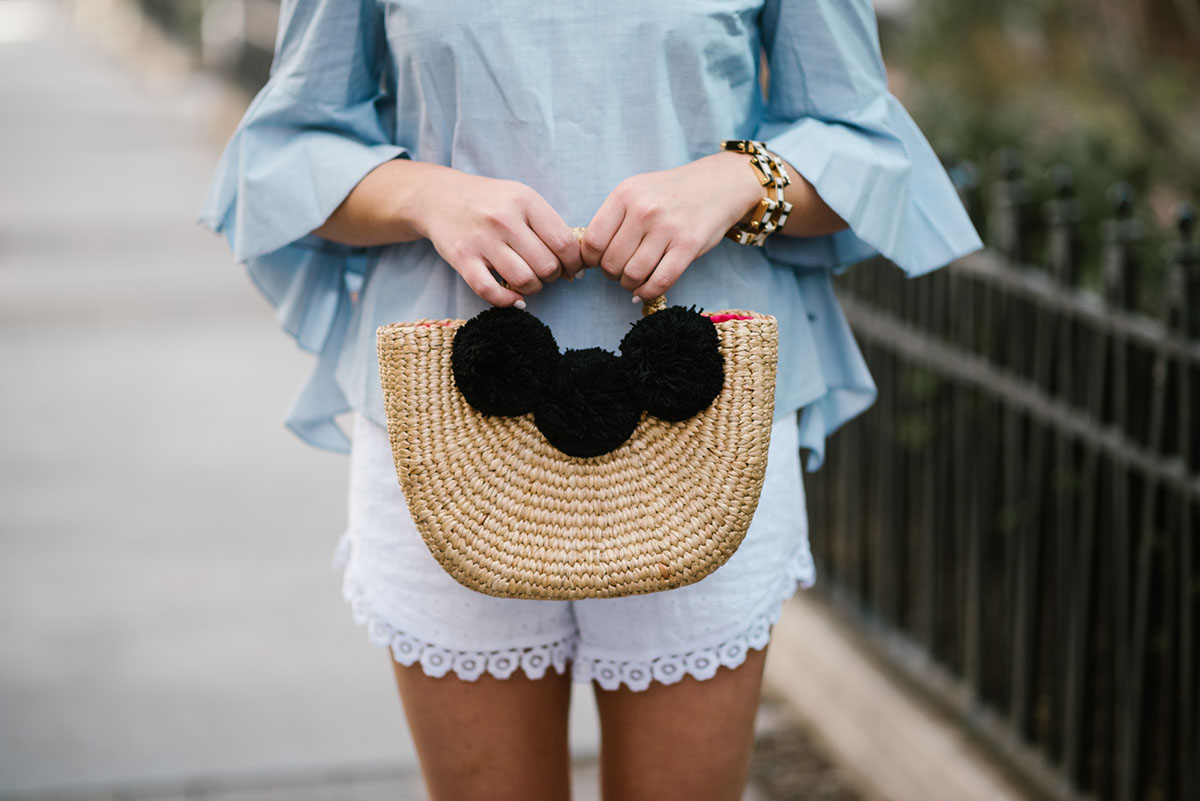 Chicago blogger Bows & Sequins holding a JadeTribe pom pom basket tote.