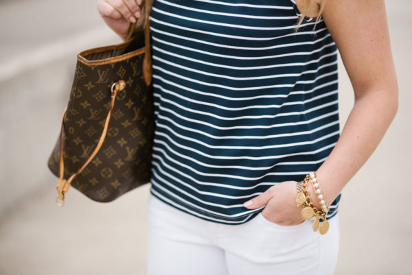 Chicago-based blogger Bows & Sequins wearing a Sail to Sable top with a Julie Vos coin bracelet and Lele Sadoughi pearl cuff and a Louis Vuitton Neverfull bag.
