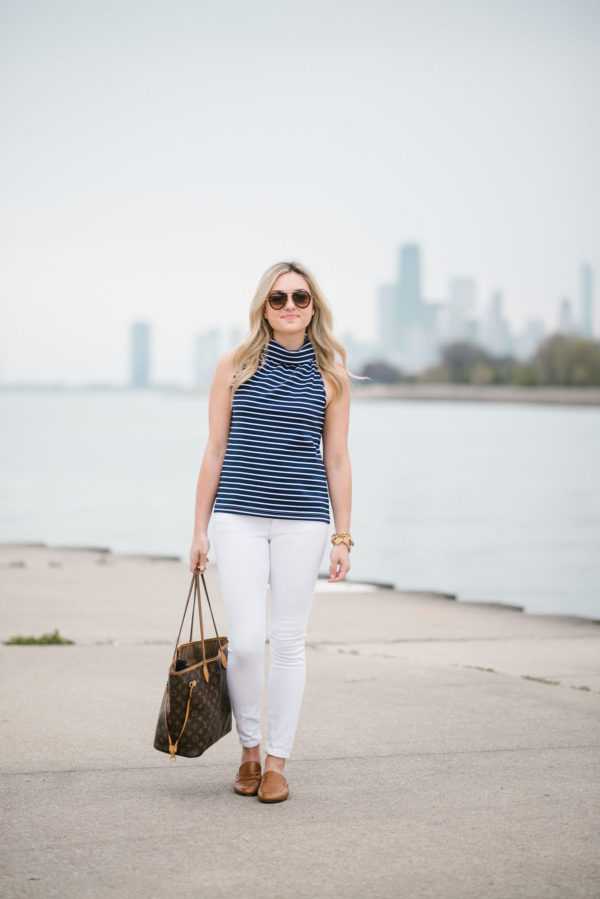 Chicago blogger Bows & Sequins wearing a striped halter tank, white denim jeans, and Dune London leather slides with Celine tortoise aviators.