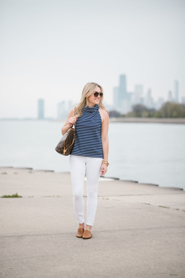 Chicago blogger Bows & Sequins styling a Sail to Sable navy striped top with Old Navy jeans, a Louis Vuitton tote, Celine aviators, and Dune London leather mules.