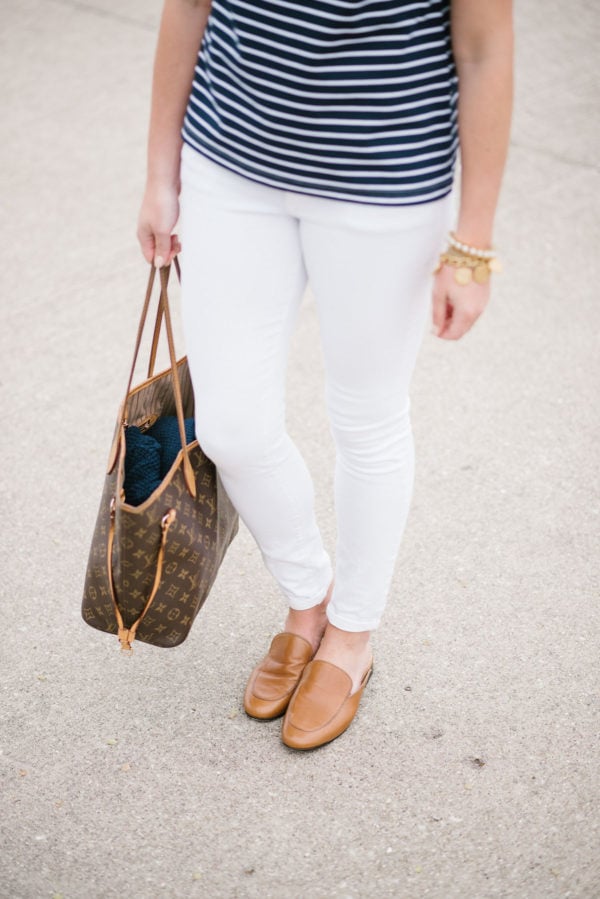 Fashion focused lifestyle blogger Bows & Sequins styling white Old Navy jeans with a Louis Vuitton Neverfull bag and brown Dune London slip-on loafers.