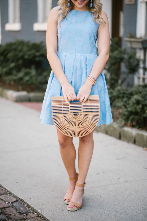 Chicago lifestyle blogger Bows & Sequins wearing a blue Sail to Sable dress with a Cult Gaia bamboo bag, a Lele Sadoughi pearl cuff, and Vince Camuto leather wedge sandals.
