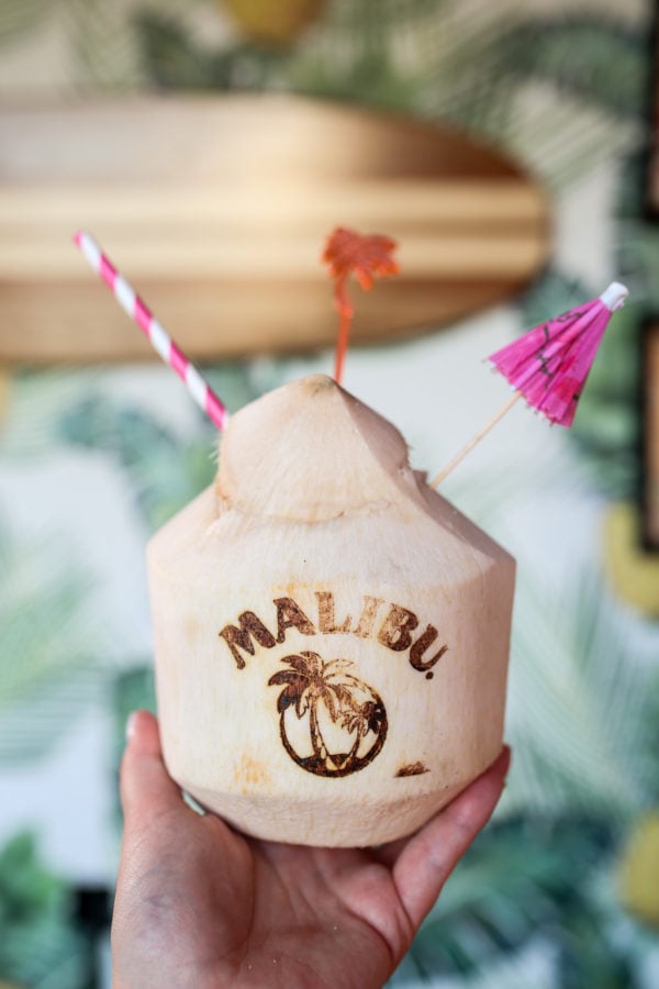 A Malibu Rum coconut cocktail with a striped straw and paper umbrella at Tiki Tabu in NYC