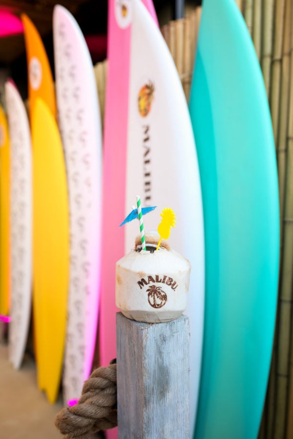 Colorful surf boards and a coconut cocktail by Malibu Rum at the summer kick off party in NYC at Tiki Tabu in the Sixty LES hotel.