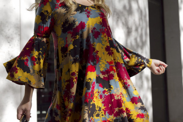 Bows & Sequins wearing a Rachel Pally printed bell sleeve dress.