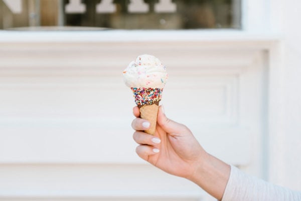 Bows & Sequins holding an ice cream cone in Chicago.
