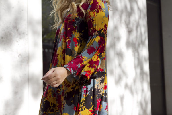 Bows & Sequins wearing a Rachel Pally bell sleeve dress in London.