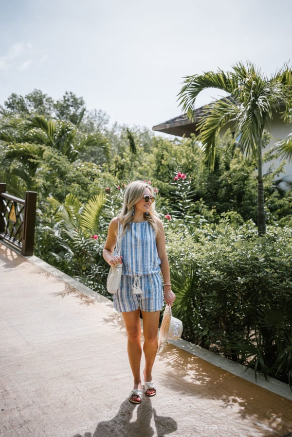 Lifestyle blogger Bows & Sequins wearing a nautical blue and white Vineyard Vines romper with a rope waist tie in Mexico.