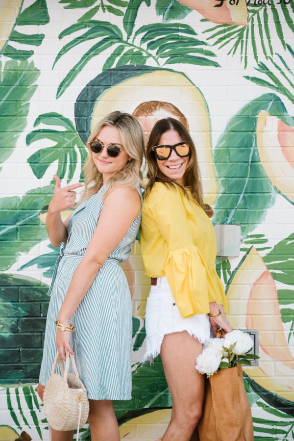 Bows & Sequins wearing a striped midi dress, Hadid tortoise sunglasses and a Clare V straw bag and Among Other Things wearing mirrored sunglasses and a yellow Zara blouse with a leather tote.