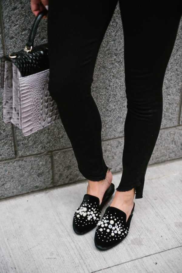 Chicago lifestyle blogger Bows & Sequins styling Steve Madden pearl slides with a Brahmin bag and raw hem Paige jeans.