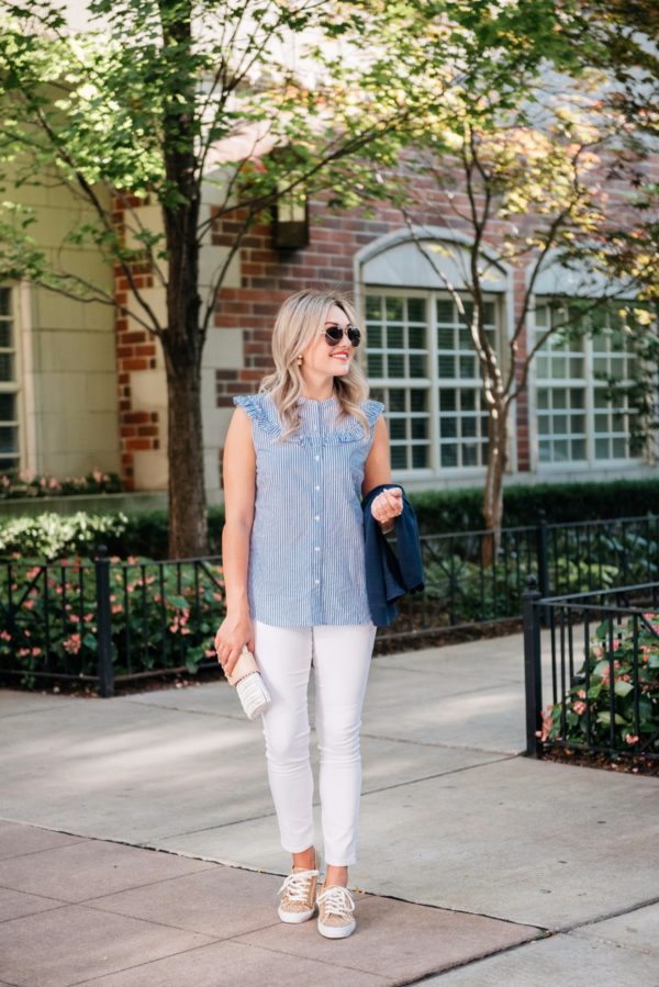 Chicago-based lifestyle blogger Bows & Sequins wearing Gucci aviators, a sleeveless chambray ruffle top, white denim jeans, and Old Navy leopard sneakers with a Julie Vos gold cuff.
