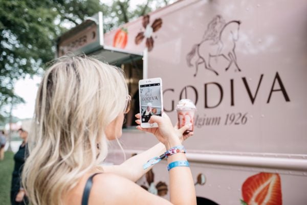 Bows & Sequins trying Godiva Chocolate's new Chocolixir drink at Lollapalooza in Chicago.