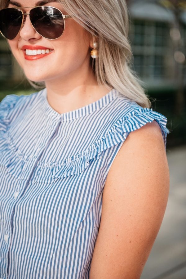 Bows & Sequins wearing Gucci sunglasses and a striped chambray sleeveless ruffle top.