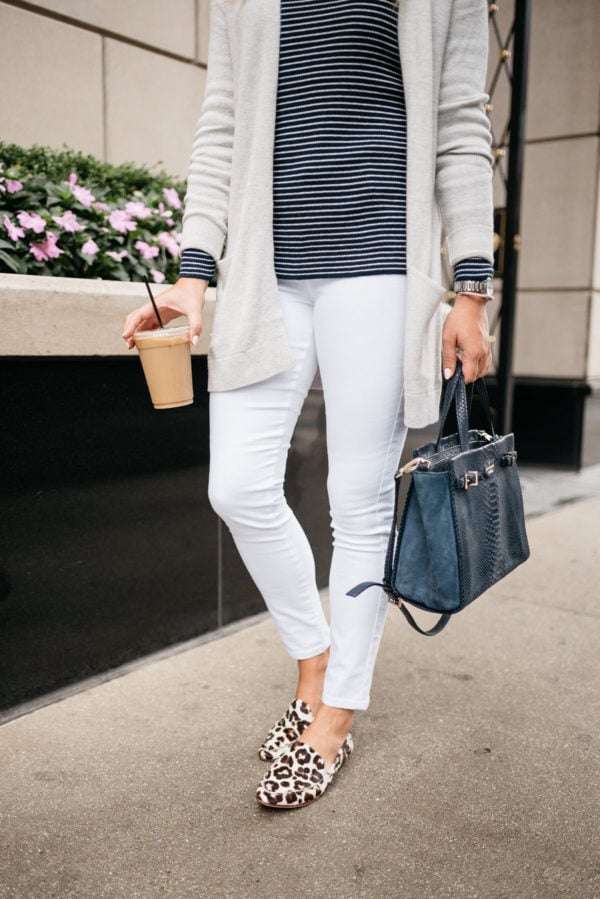 Chicago blogger Bows & Sequins wearing Old Navy white jeans, Kate Spade leopard loafers, a navy striped sweater, and a cardigan with a navy Kate Spade tote.