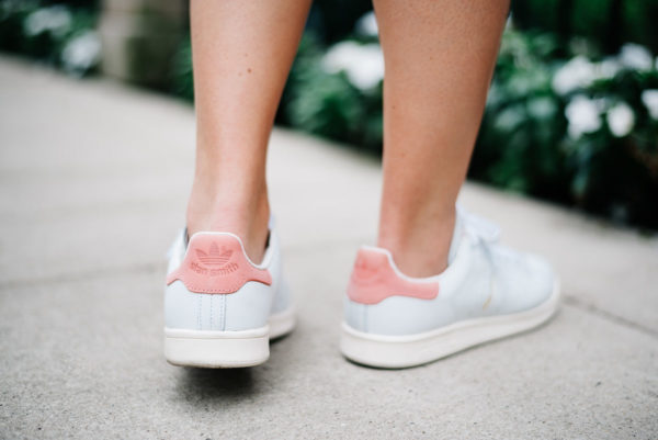 Bows & Sequins wearing pink Stan Smith sneakers.