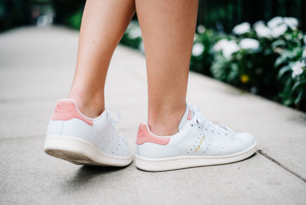 Bows & Sequins wearing white and pink Adidas Stan Smith sneakers.