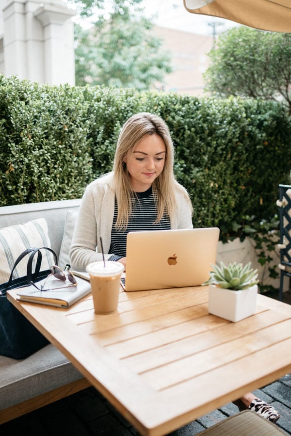 Bows & Sequins working at Petit Margeaux at the Waldorf Astoria in Chicago, wearing an Old Navy cardigan and striped navy sweater.
