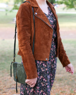 Fashion and style blogger Bows & Sequins wearing a Blank NYC cognac suede jacket and Joelle Hawkens green leather shoulder bag.
